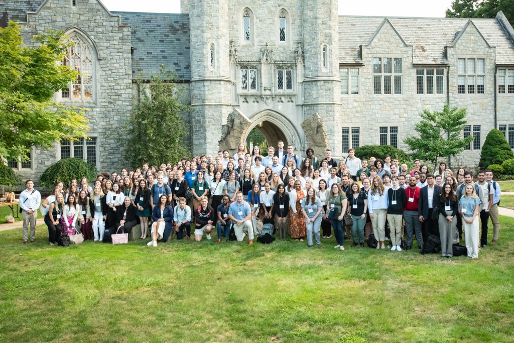 New law students in group on lawn in front of William F. Starr Hall.