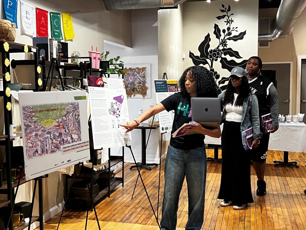 Woman pointing at poster