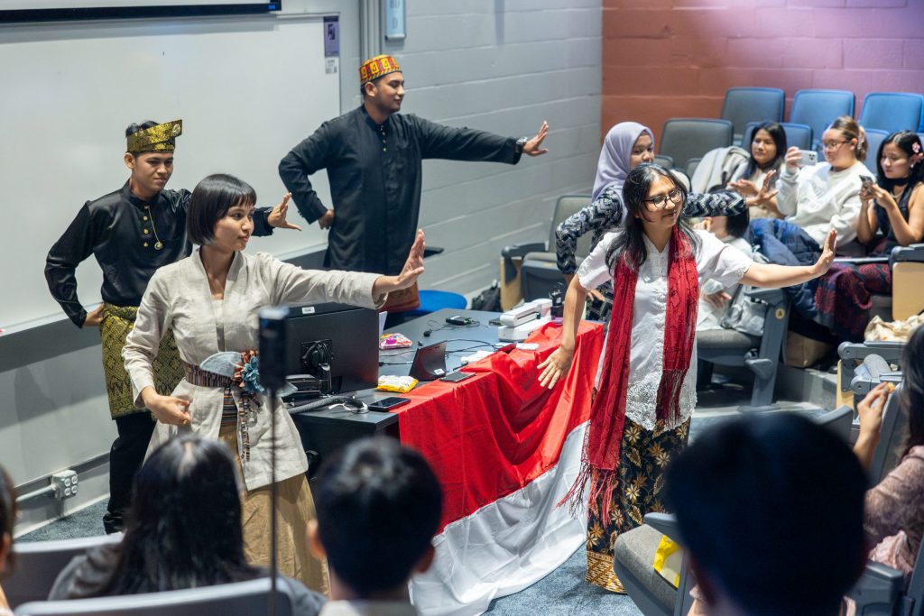 Participants in the Young Southeast Asian Leaders Initiative (YSEALI) hold a cultural fair in Monteith Building