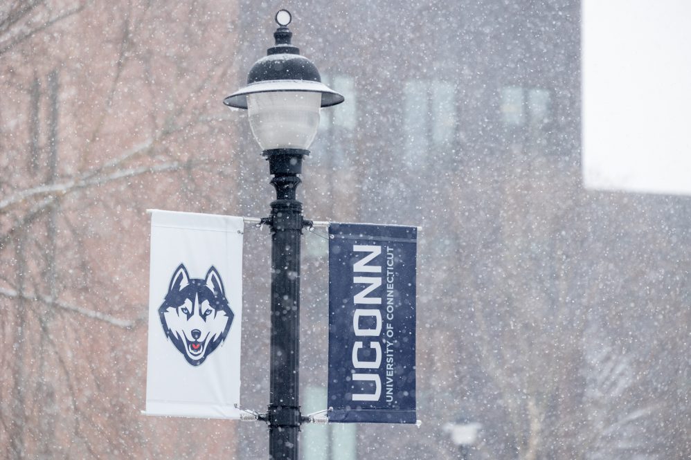 Snow falls across the UConn Storrs campus during the first snowstorm of the season