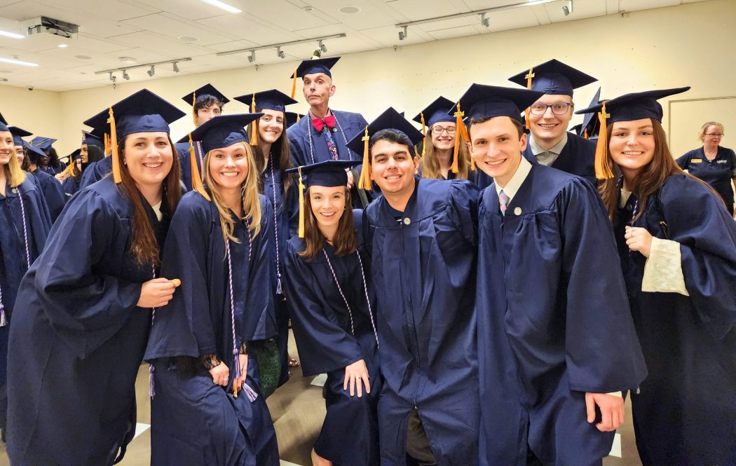 BS/CEIN nursing students lining up before 2024 commencement ceremony