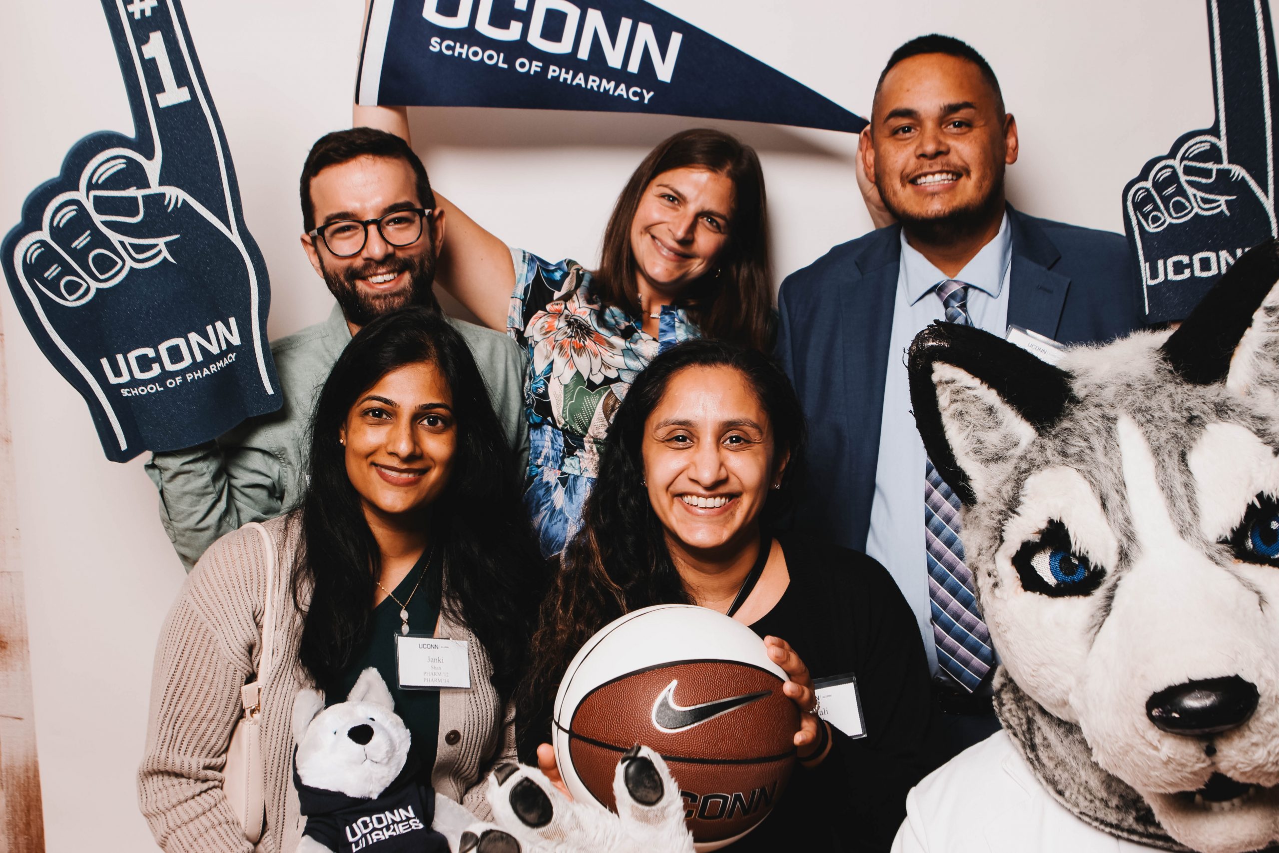 alumni celebrating with UConn gear