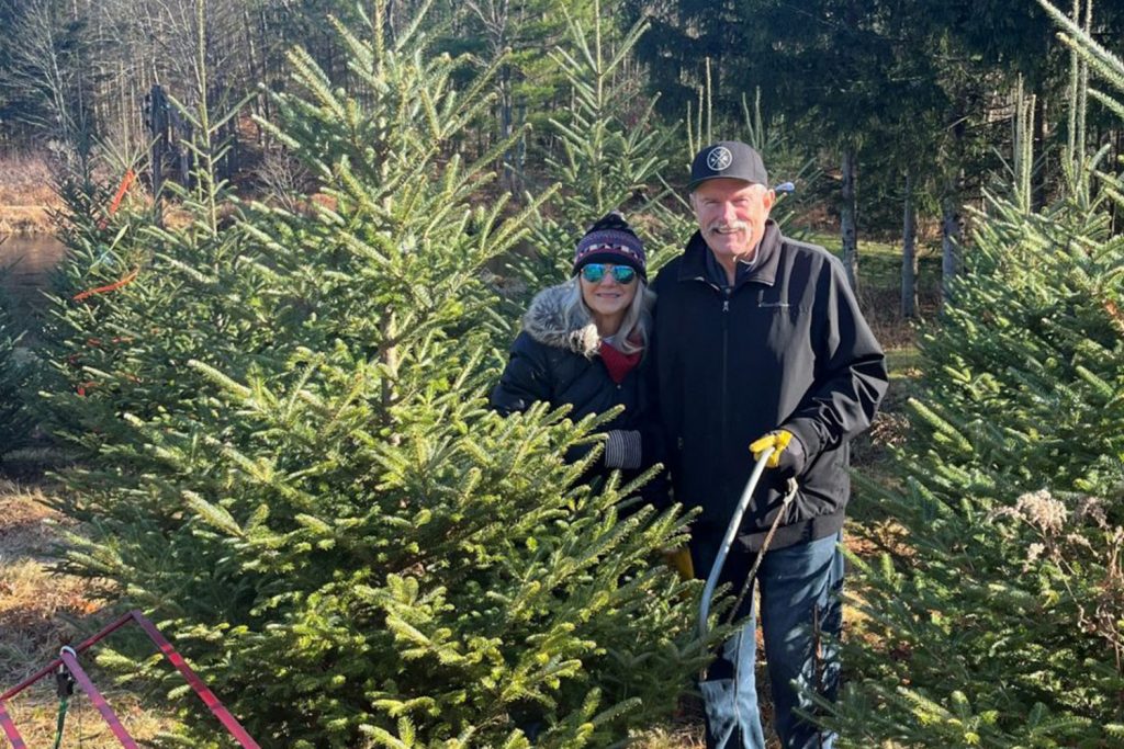 Norm Kilcomons and his wife Charlene cutting down their Christmas tree. Christmas is extra special this year for the Kilcomons family (Photo courtesy of Kilcomons family).