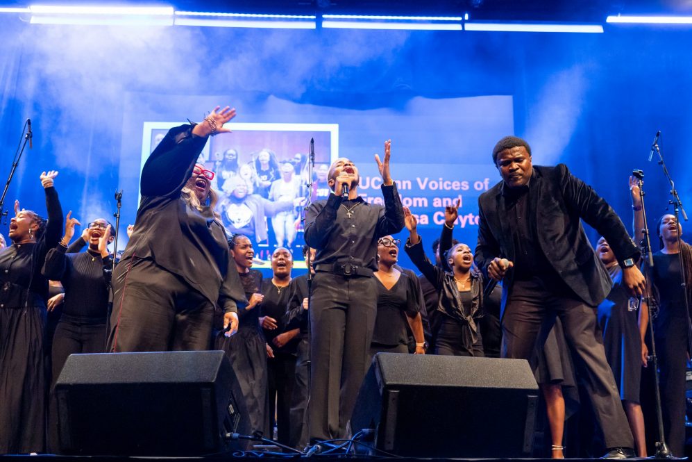 UConn's Voices of Freedom choir performs on stage.