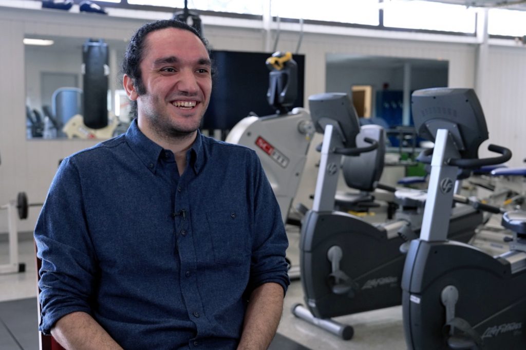 Man smiling in gym facility